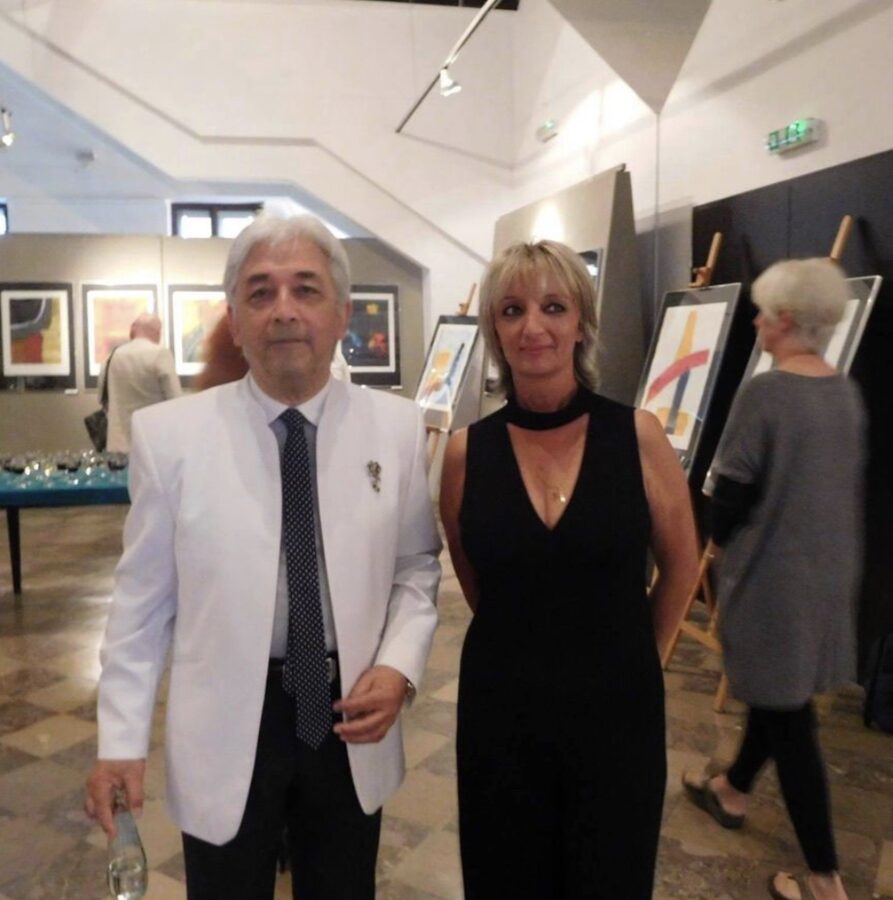 Ludolf Grollé with a guest at a gallery opening