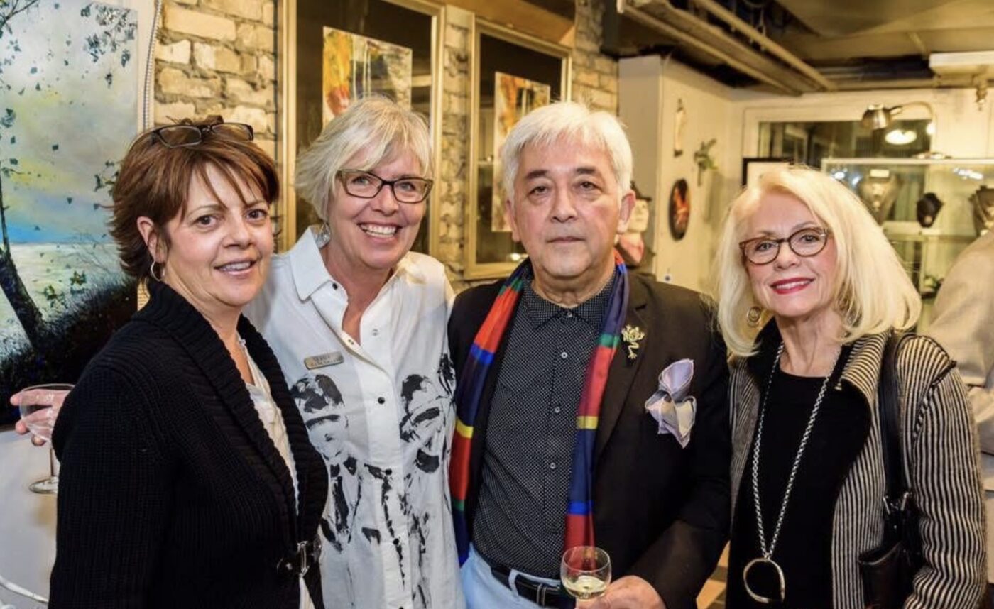 Ludolf Grollé with guests at a gallery opening