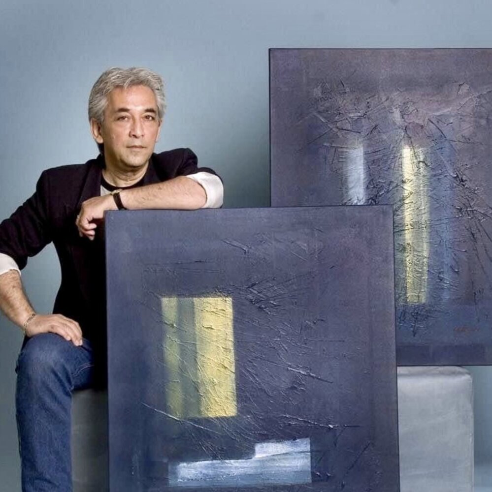 Ludolf R. Grollé with two of his paintings